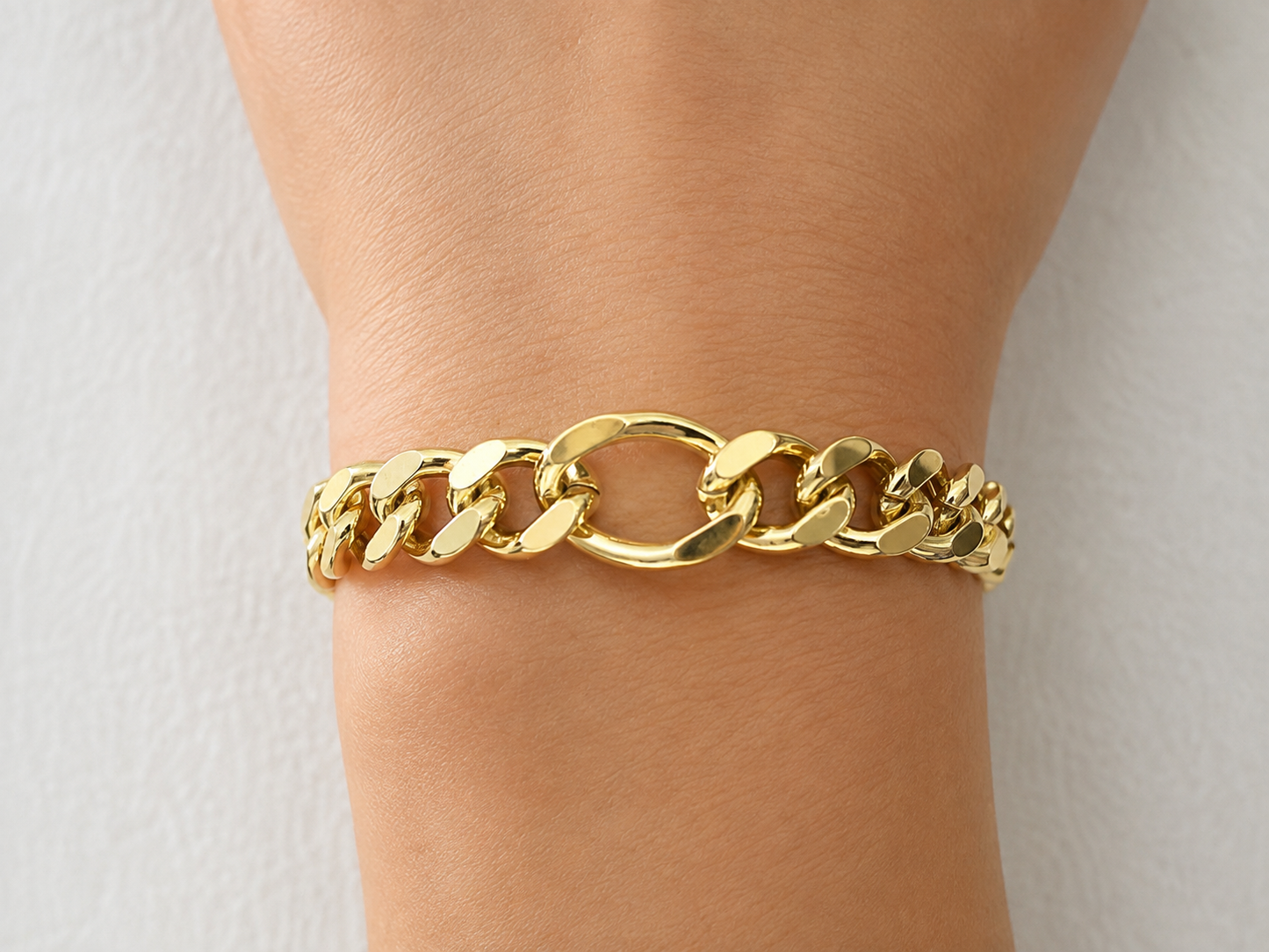 Gold Cuban Link Bracelet with Oval Center Link